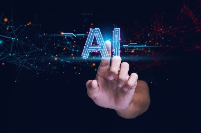 Futuristic image of a finger pointing at the letters AI